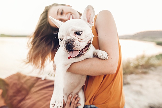 Woman holding holding her doggy